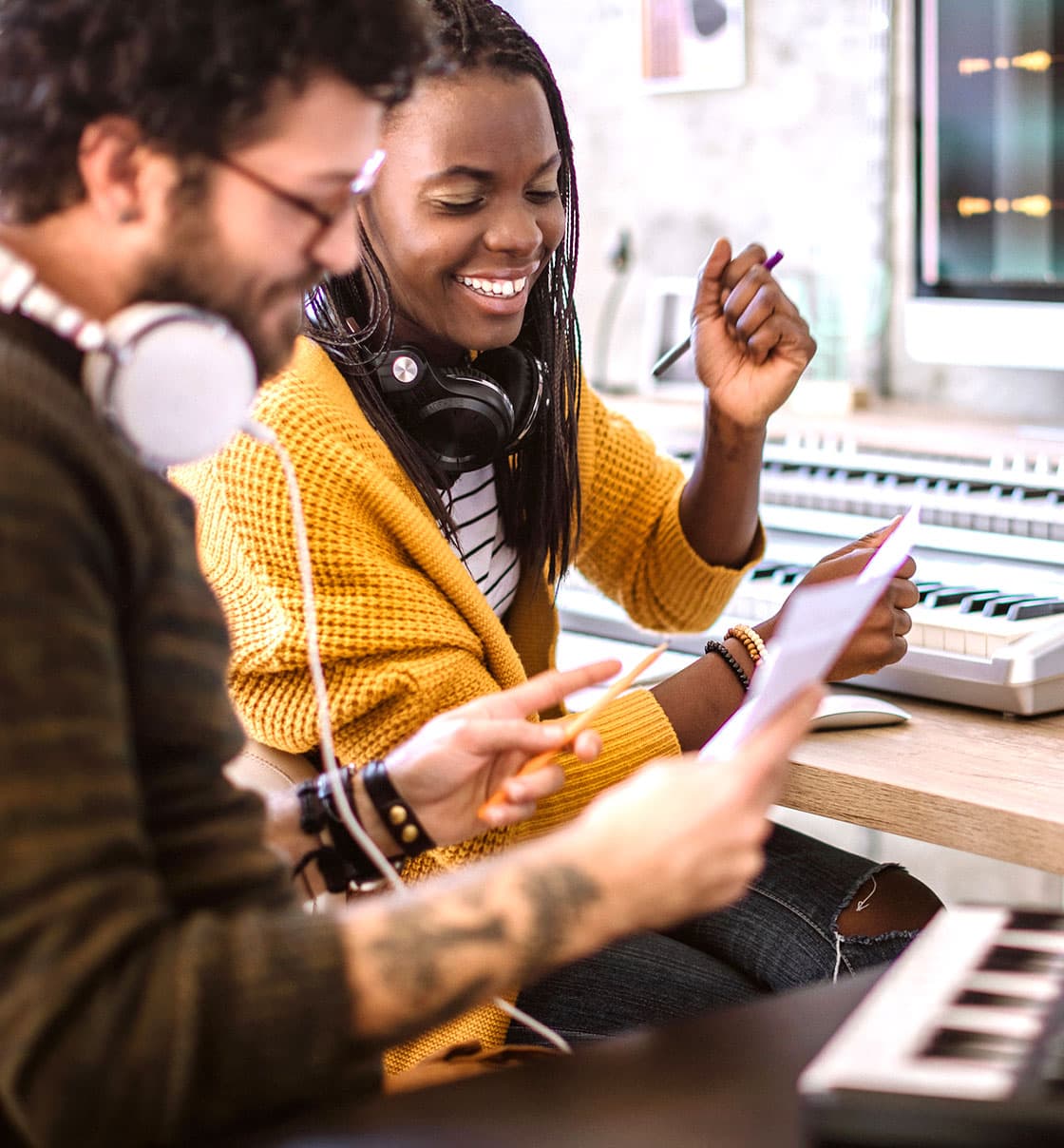 Image of two co-workers working at the office